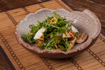 Salad with arugula and roast pork