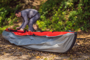 Father and son prepare a kayak for rowing on the sea