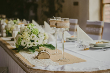 Beautifully decorated wedding table and other details at wedding hall. Wedding day.