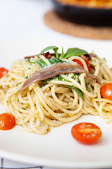 Spaghetti with anchovy, cherry tomato, onion, chili and pamersan cheese