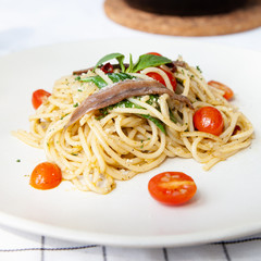 Spaghetti with anchovy, cherry tomato, onion, chili and pamersan cheese