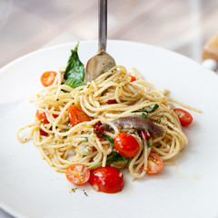 Spaghetti with anchovy, cherry tomato, onion, chili and pamersan cheese
