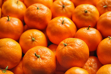 Delicious fresh ripe tangerines as background, closeup