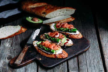 Sandwich with cream cheese, avocado, asparagus and salted salmon