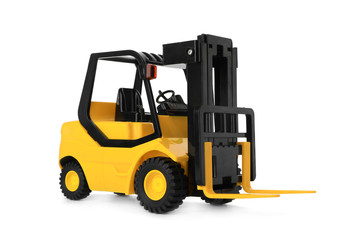 Toy forklift isolated on white. Logistics and wholesale concept