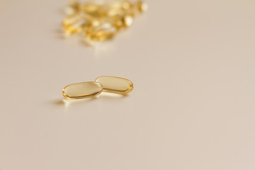 omega vitamins in capsules on a white background. a handful of vitamins in tablets for human health. concept of medicine and health. space for text. the view from the top.