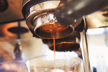 pouring red wine into glass
