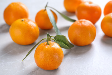 Tasty fresh ripe tangerines on light table