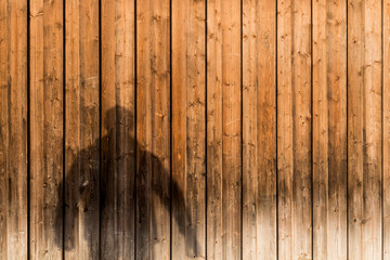 Shadow of a man on wooden background