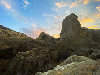 Ancient rock formations. A famous place for flying in balloons. View of Cappadocia at sunset. Turkey November 5, 2019.