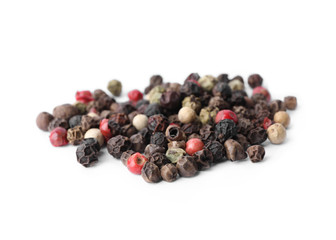 Mix of different pepper grains isolated on white