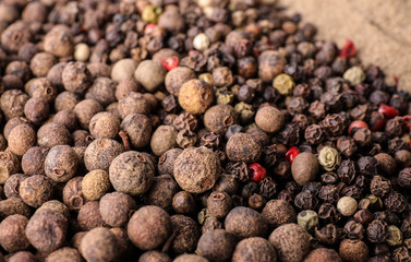 Different spicy peppers as background, closeup view