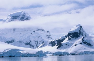 Fototapeta na wymiar Antarctica Snow covered mountains and icebergs