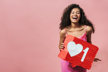 Image of funny african american woman holding placard and laughing
