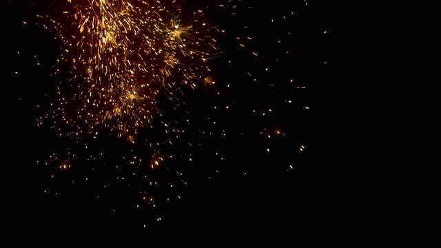 Welding sparks falling on black background