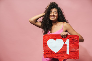 Image of funny african american woman holding placard and laughing