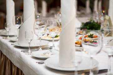 Served for banquet restaurant table with dishes, snack, wine glasses