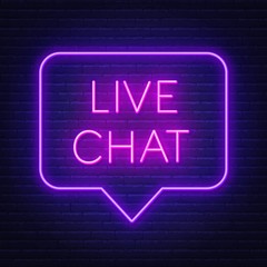 Live chat neon sign on the wall background.