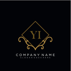 Initial letter YI logo luxury vector mark, gold color elegant classical 