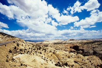 Cloudscape above rocky landscape
