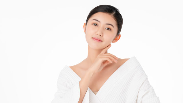 Healthy skin,Facial treatment and cosmetic ideas concept.Smiling happy face of a pretty young asian woman with creative hairstyle and Clean Fresh bare Skin concept.Asian Girl beauty face skincare.
