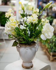 Flower arrangement of artificial, natural flowers