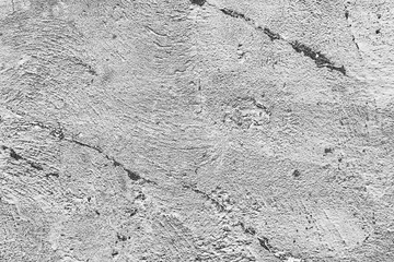 Texture of a concrete wall with cracks and scratches which can be used as a background