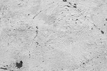 Texture of a concrete wall with cracks and scratches which can be used as a background