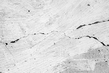 Texture of a concrete wall with cracks and scratches which can be used as a background