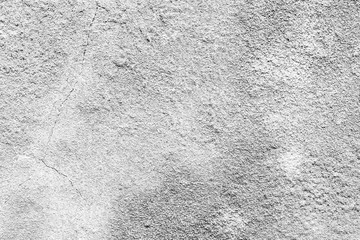 Texture of a concrete wall with cracks and scratches which can be used as a background