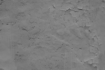 Texture of a concrete wall with cracks and scratches which can be used as a background