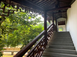 External stairs leading up to the second floor of a traditional Asian building