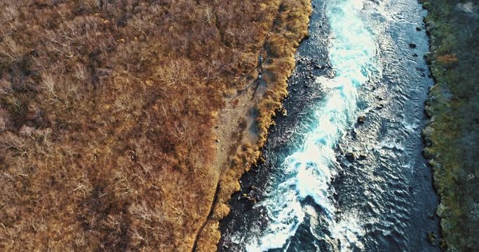 aerial shot of famous Iceland with its beautiful fascinating unique landscape, rivers, mountains, glaciers and waterfalls on a clear sunny day - great 4k shots for nature travel bloggers