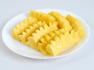 Pineapple slices in white plate