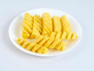 Pineapple slices in white plate