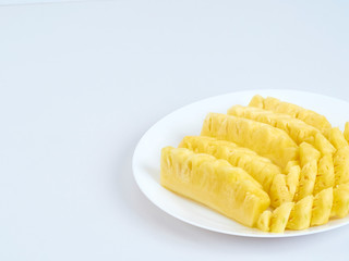 Pineapple slices in white plate