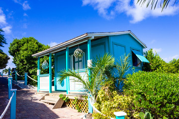 Fototapeta na wymiar Colorful tropical cabana or shelter on the beach of Half Moon Cay