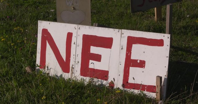 protest sign NEE (Dutch for NO) in grass