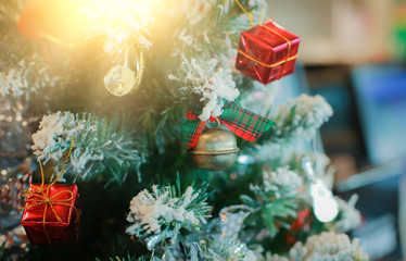 Blurry of Christmas and New Year's balls with beautiful decorations on the Christmas tree, soft light, beautiful background images and illustrations.