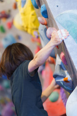 Obraz na płótnie Canvas Lady and landscape of Bouldering climbing studio in Japan