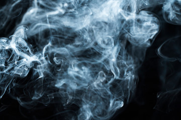 Photo of a wisp of smoke on a dark background