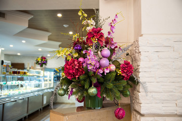 Christmas decorations on the Christmas tree. Christmas flower composition. 