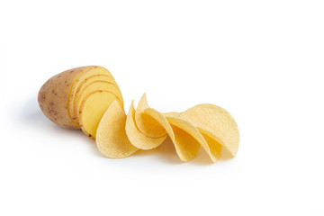 Creative photography. Sliced potatoes and chips on a white isolated background. Potatoes turn into chips.