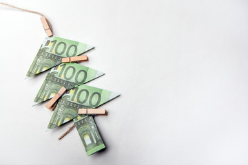 money rope clothespin leather background 