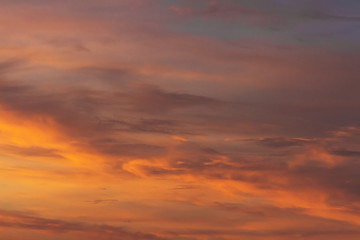 Colorful dramatic sky at sunset with pasted clouds