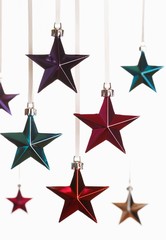 Christmas star ornaments on white background