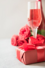 Romantic red gift with red champagne. Valentine day card.