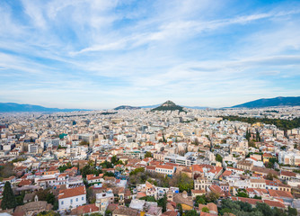 Fototapeta na wymiar Aerial view of Athens, Greece with houses, blue sky and Lycabettus hill