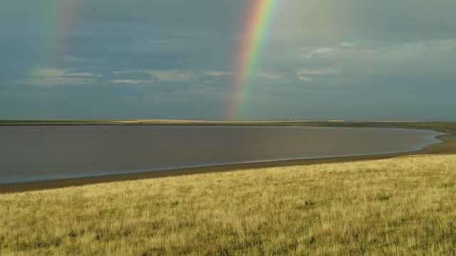 Manych Lake, Russia. Nature after rain, bright rainbow, beautiful landscape from above
