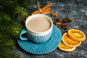 Cup of hot chocolate in winter decorations on the rustic background. Selective focus. Shallow depth of field.